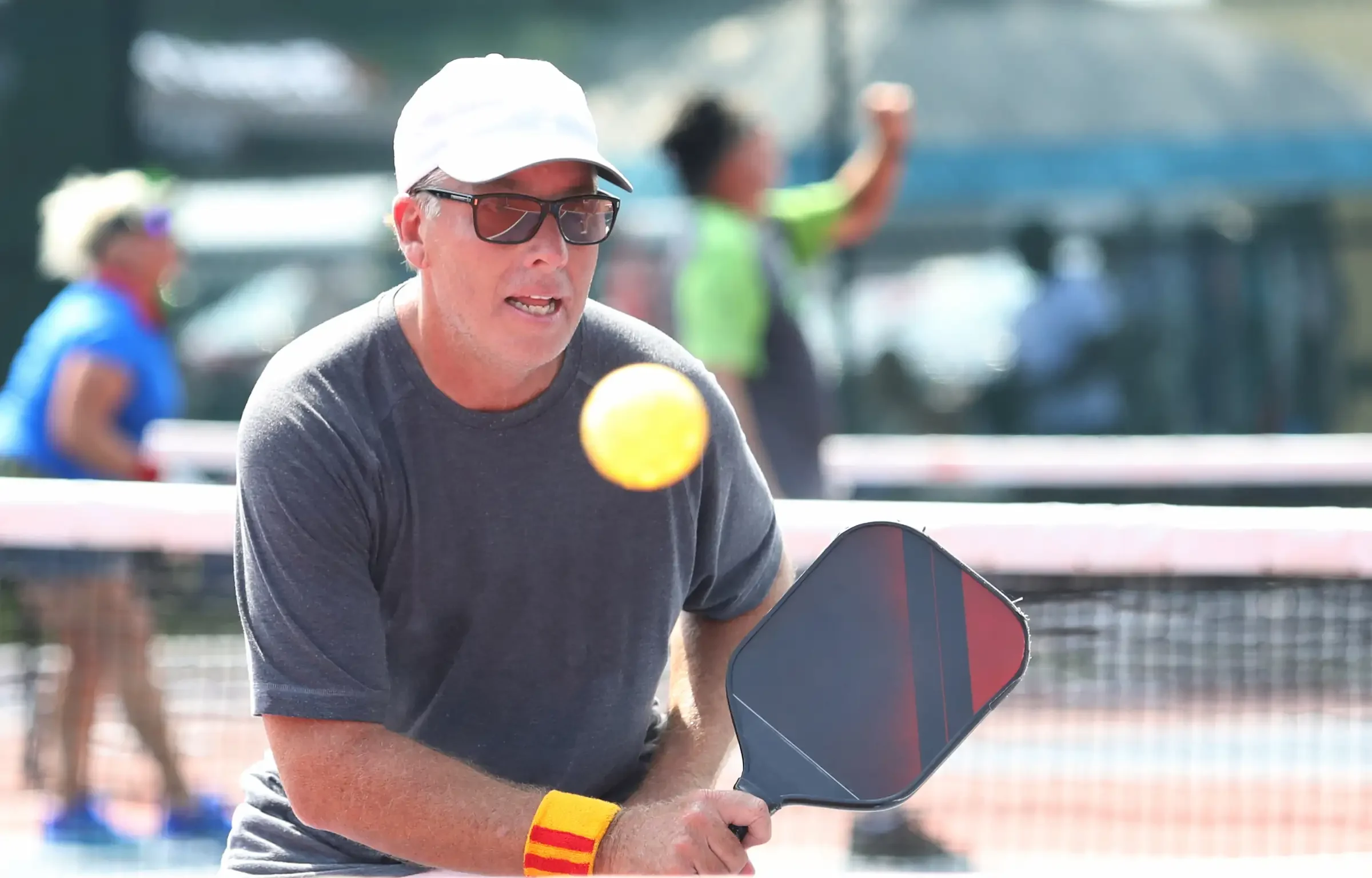 Middle-aged man playing a pickleball tournament