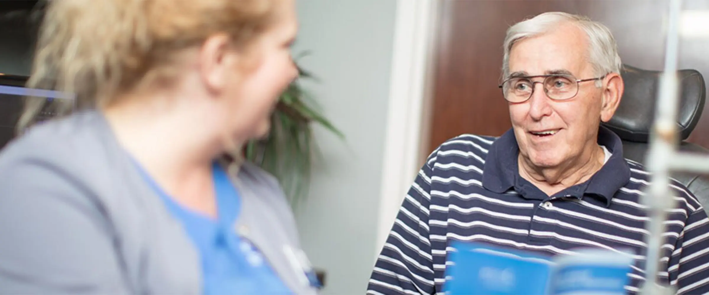 Staff member with elderly patient